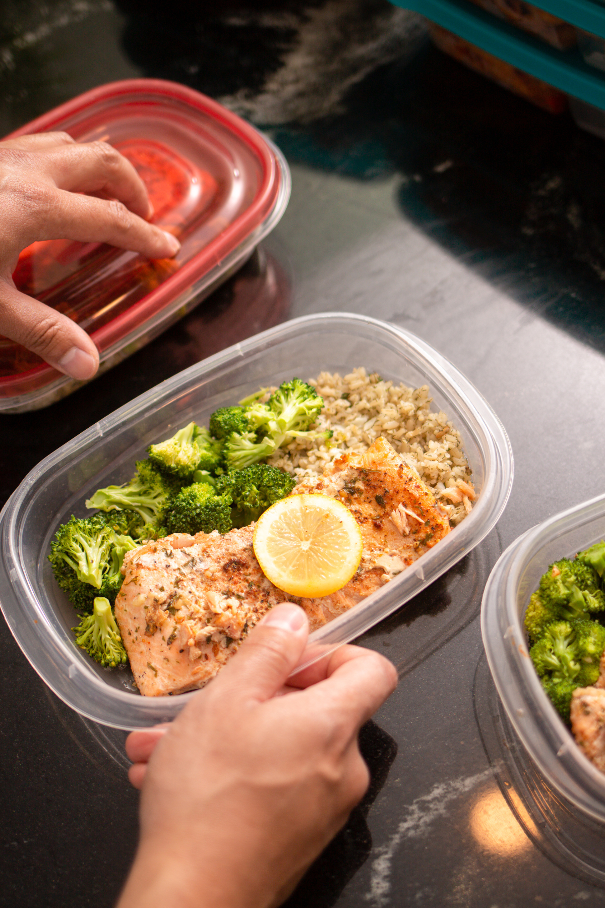 meal prep containers with food in them on counter