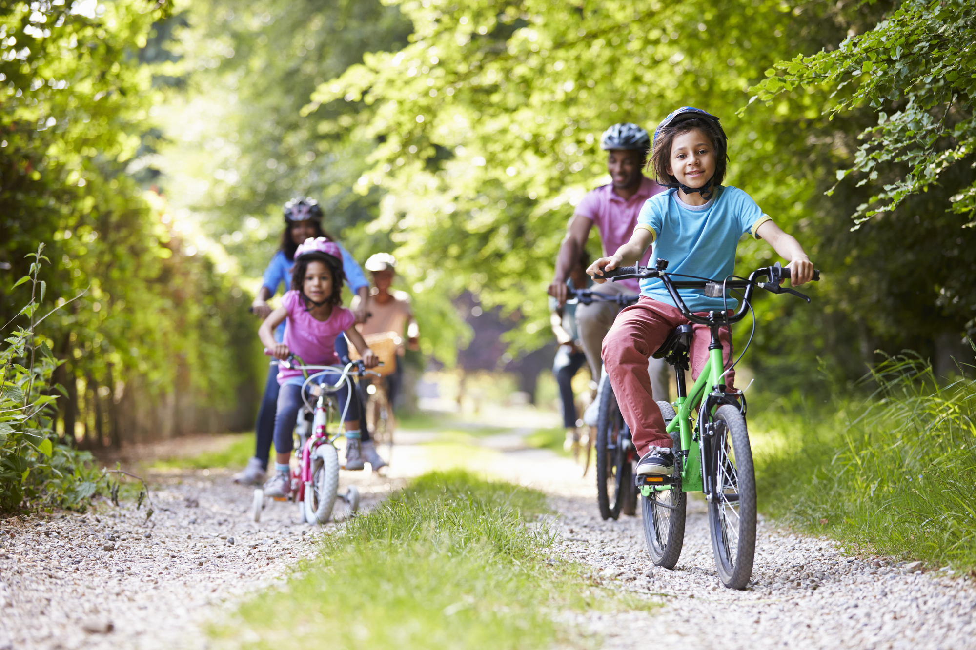 family riding a bike to help make exercise fun for kids