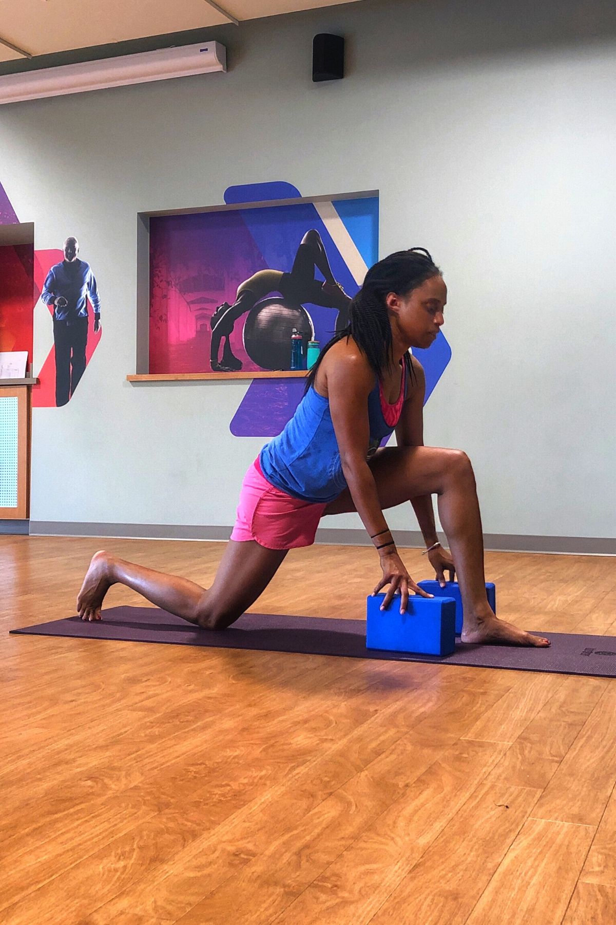 woman using yoga block to stretch