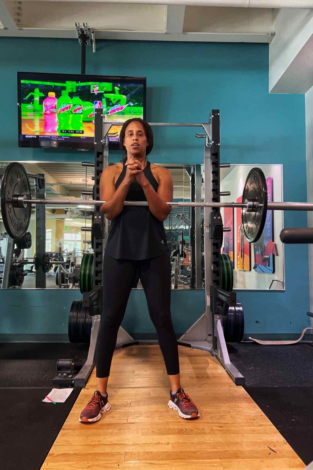 woman doing zercher squat at the gym
