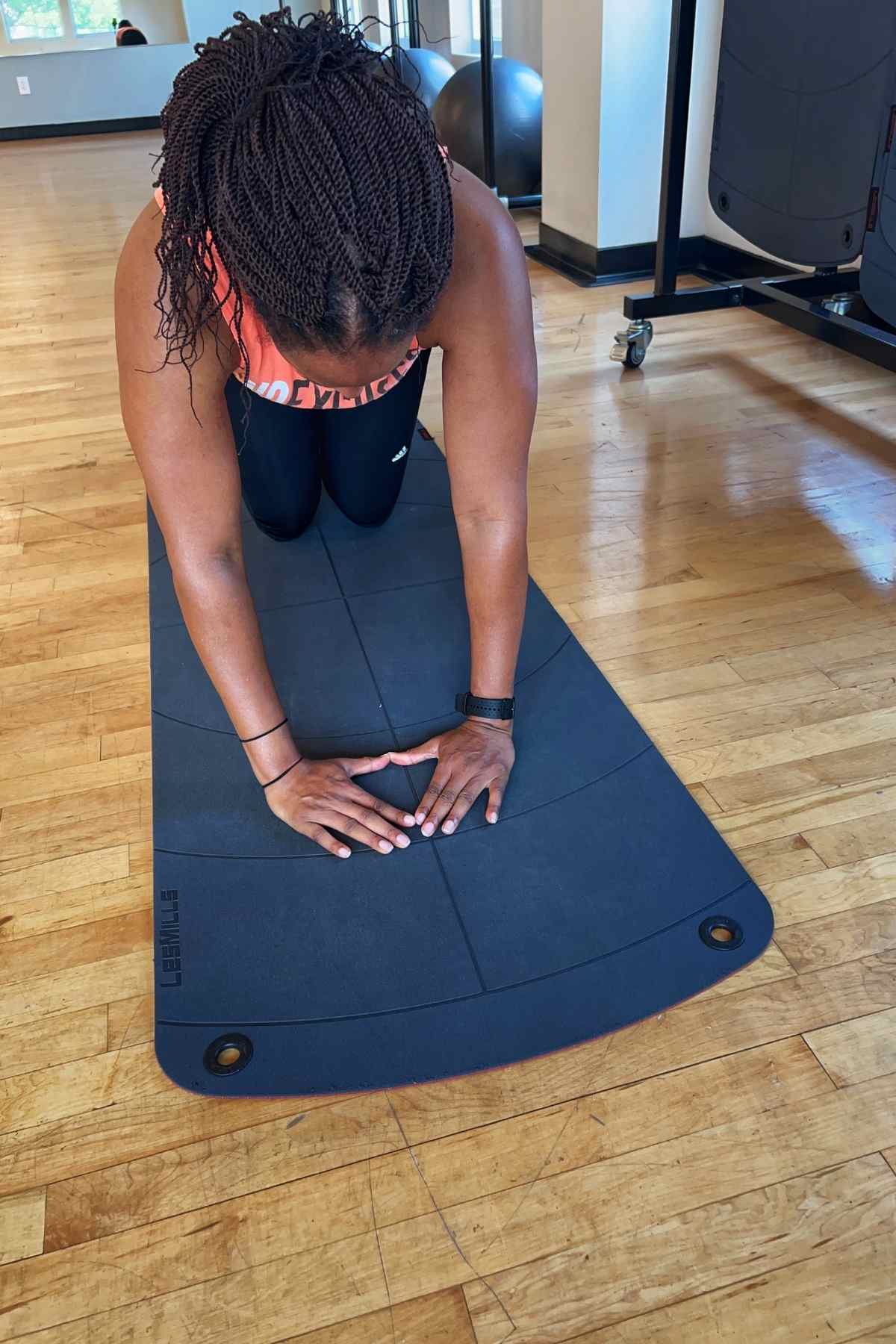 woman doing triangle pushups to work triceps