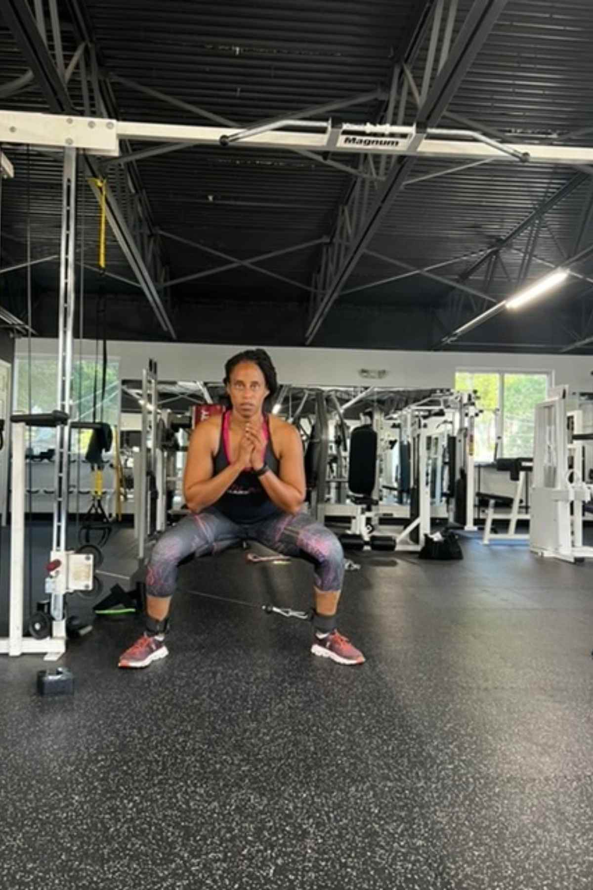 woman doing cable squats for glutes