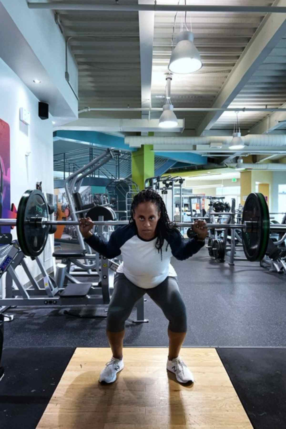 woman in lower end of barbell squat