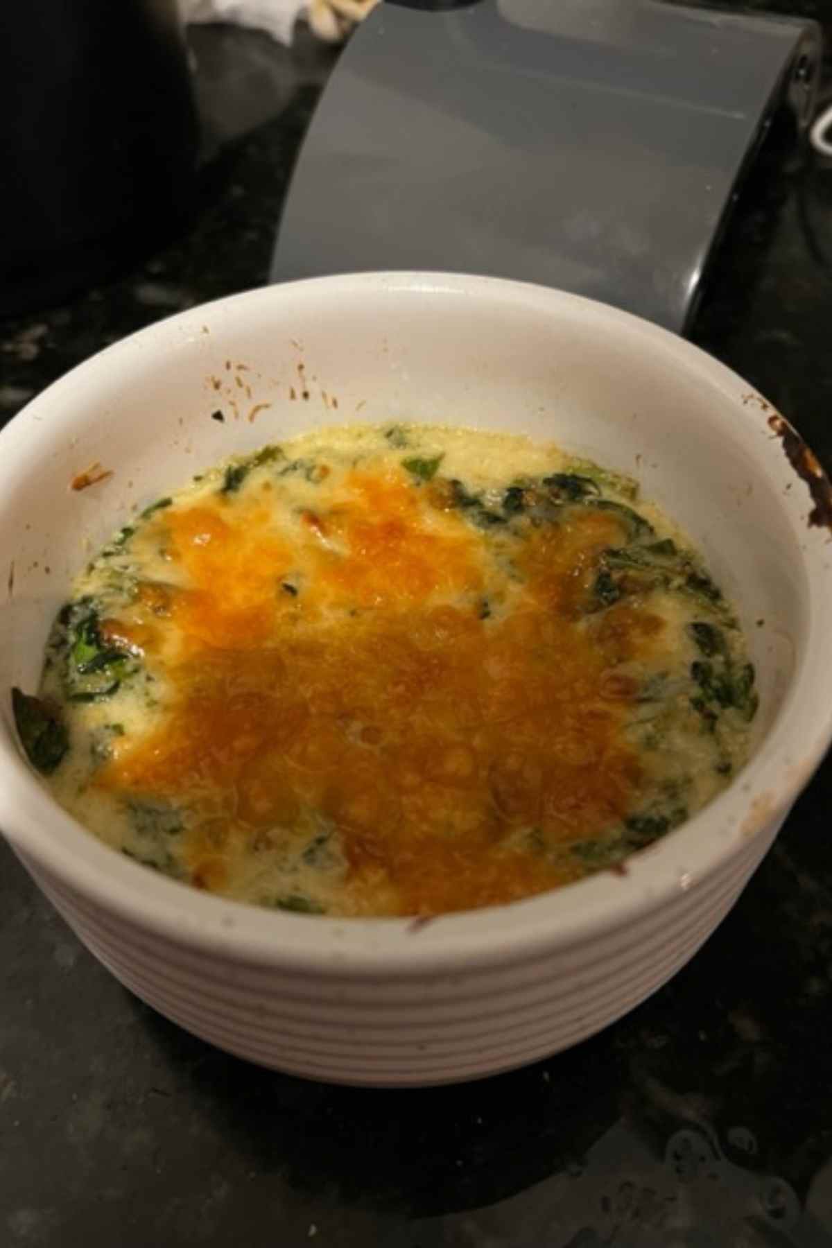 gluten free spinach dip on the counter in a white ramekin