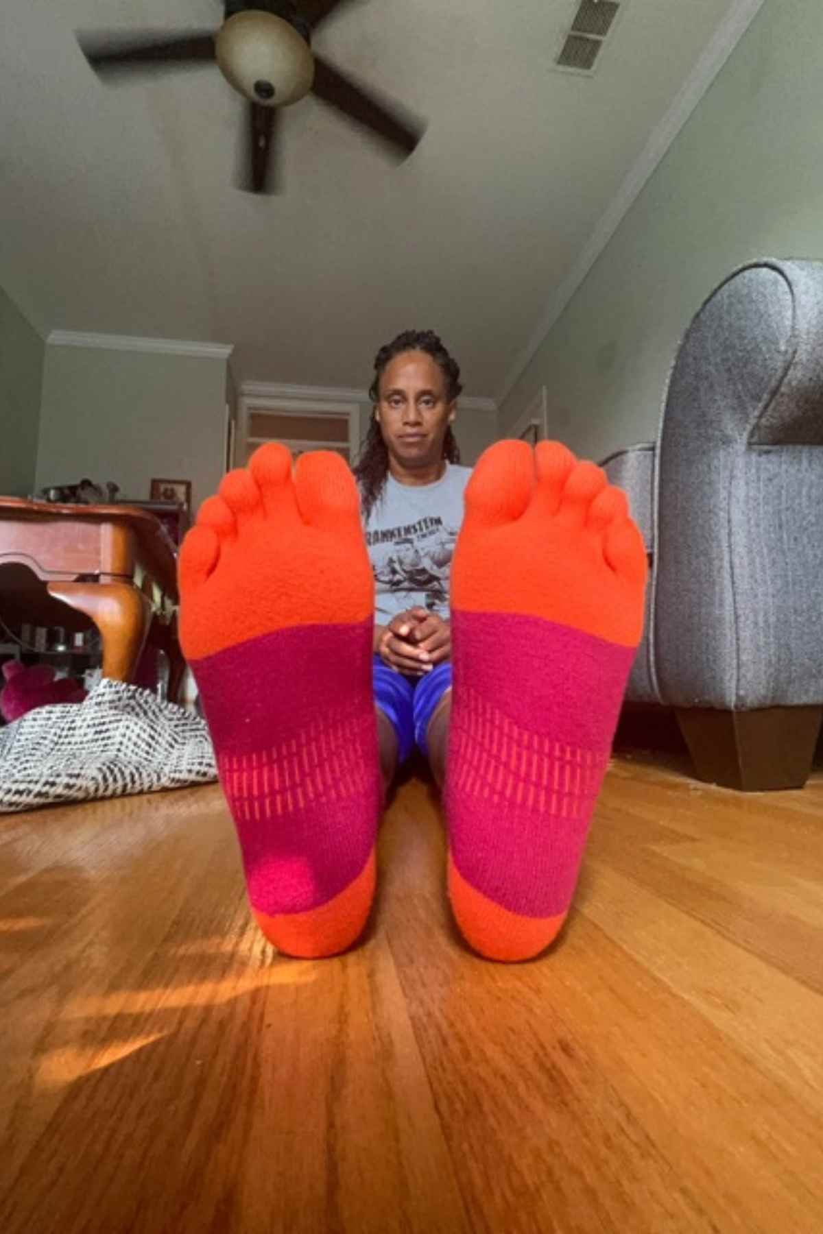 woman sitting on floor wearing injinji toe socks