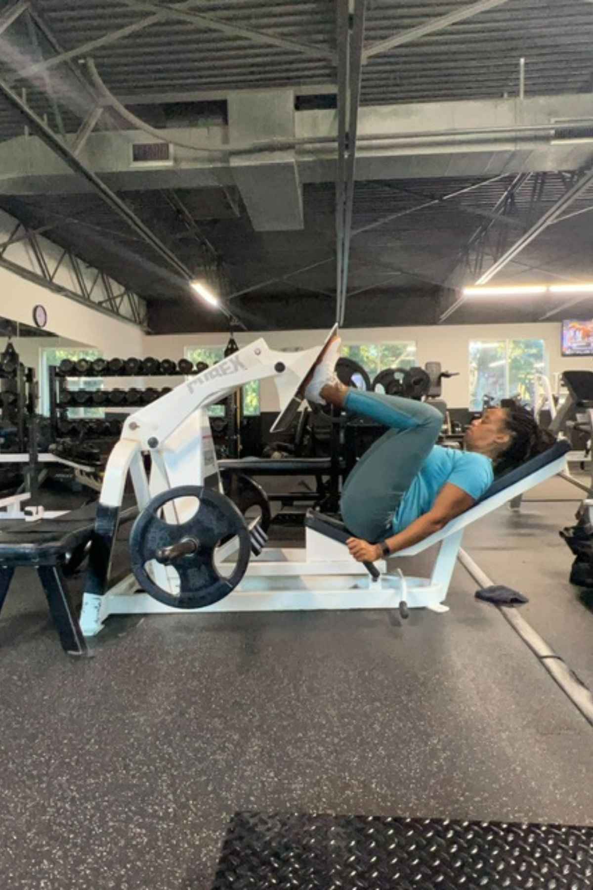woman doing leg press exercise in the gym