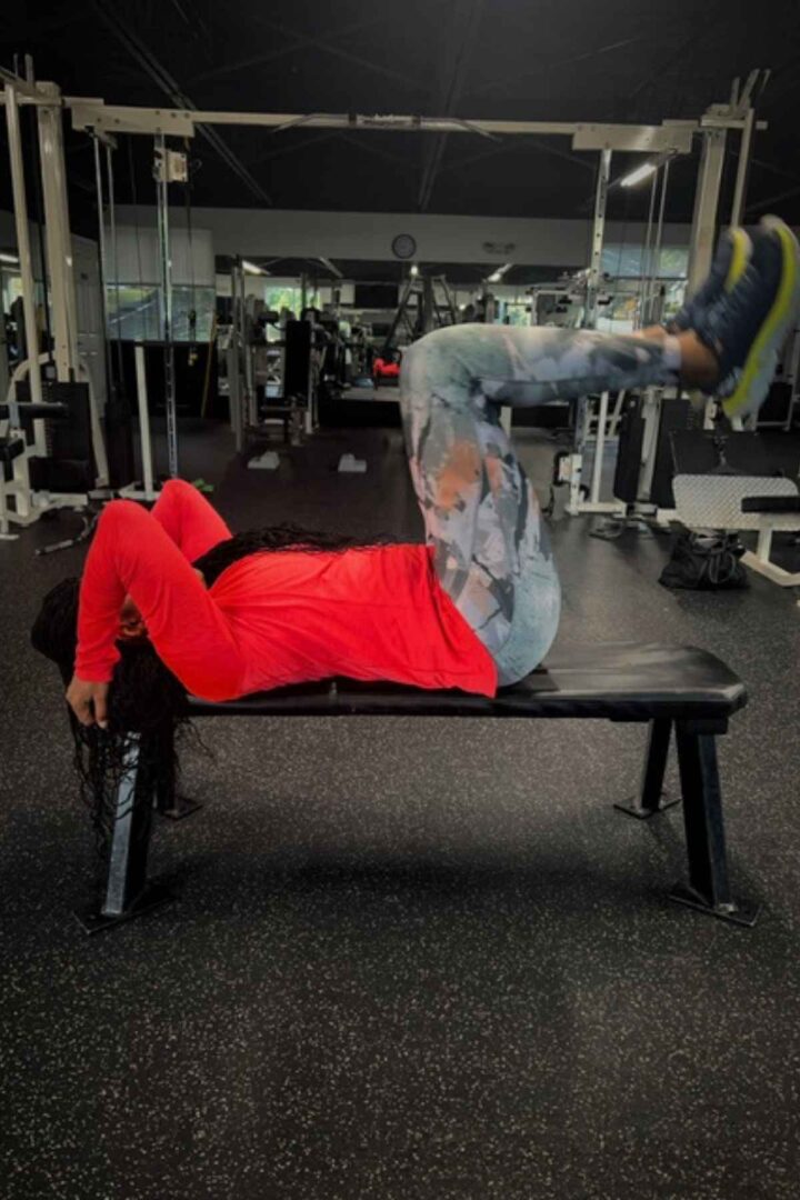 woman doing ab bench reverse crunches