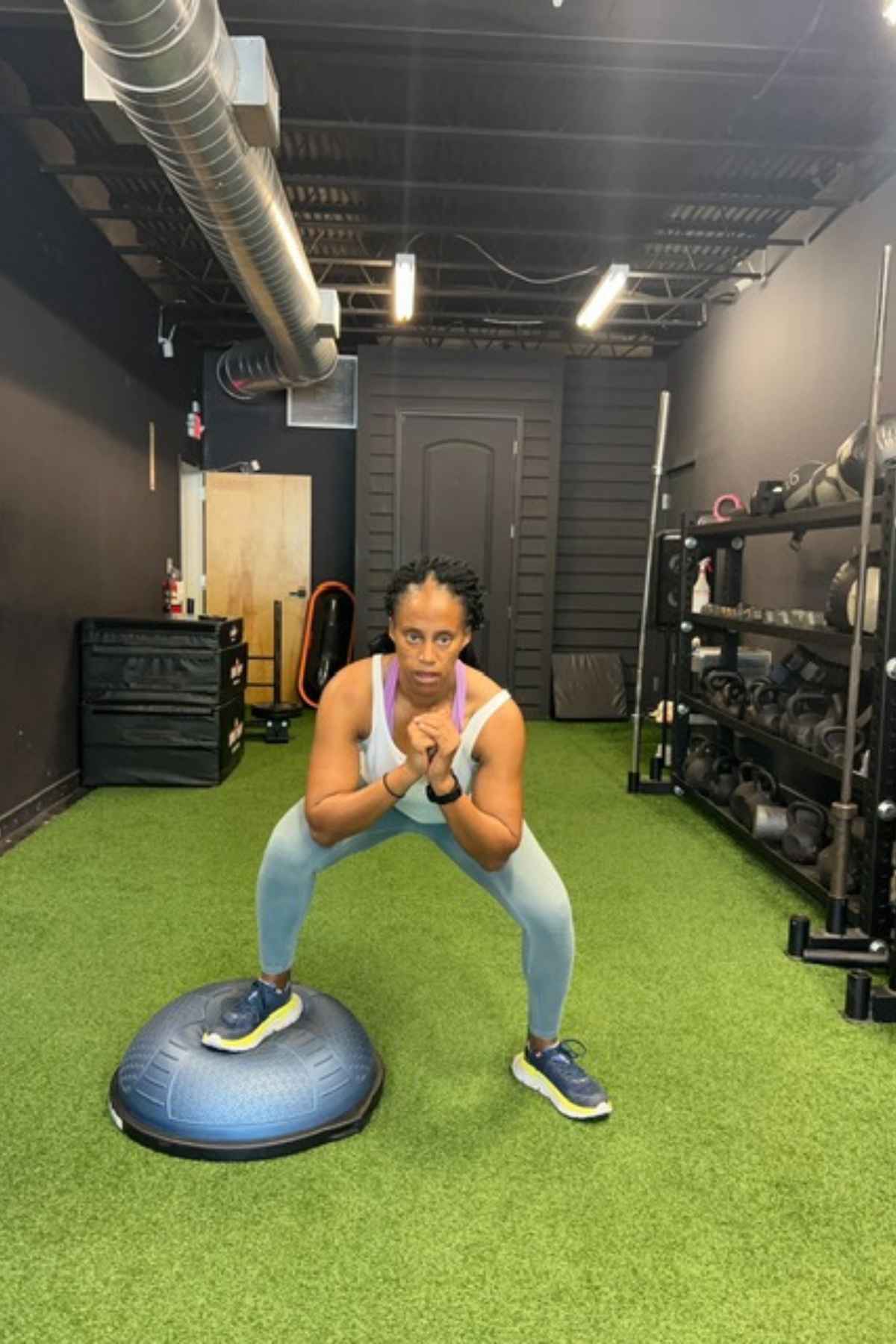 woman doing bosu ball squats