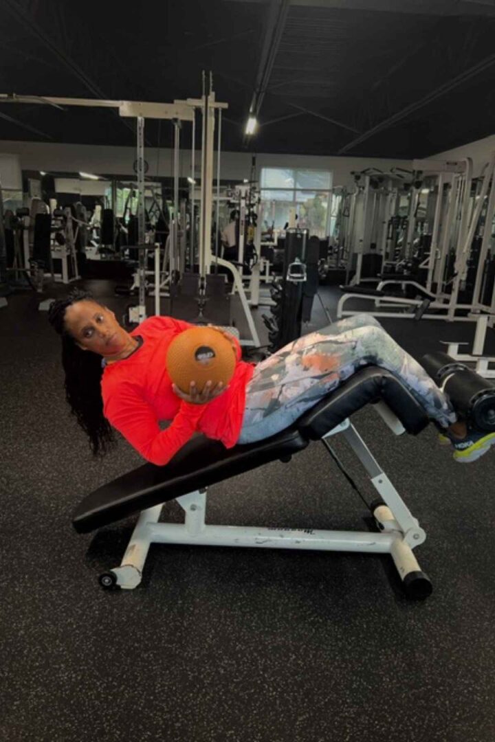 woman doing decline ab bench exercises in the gym